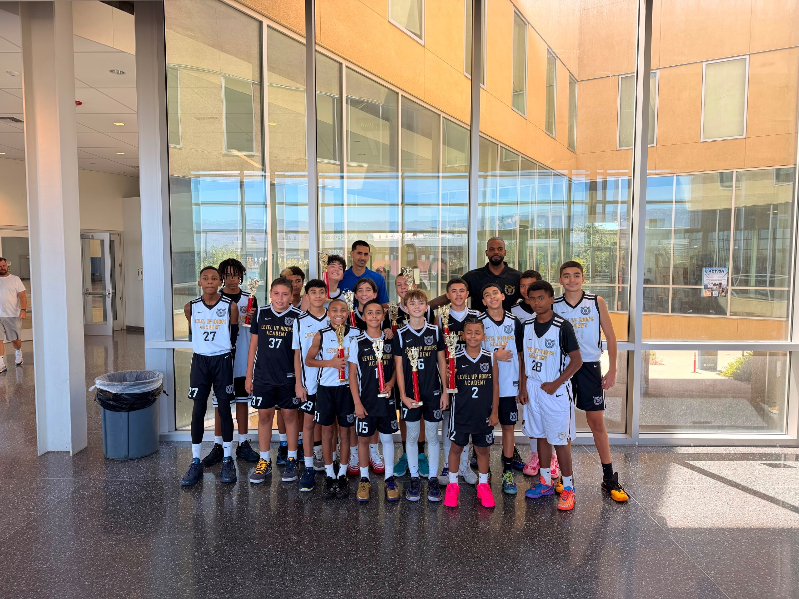 Level Up Hoops Academy team with trophies